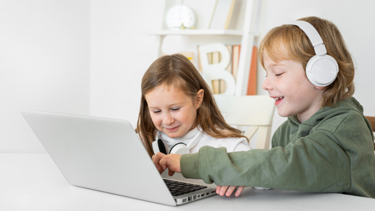young-boy-girl-using-laptop-with-headphones